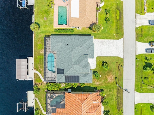 birds eye view of property with a water view