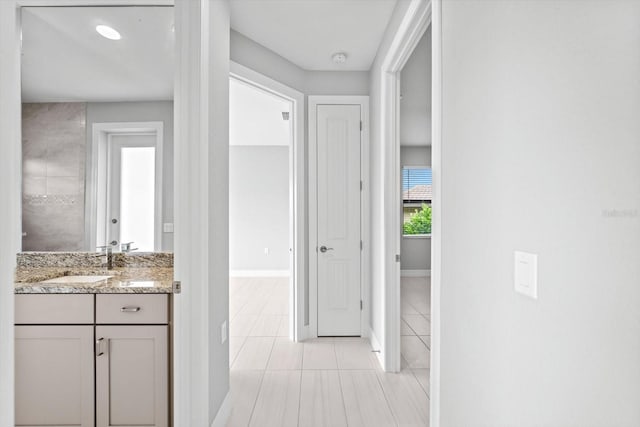5217 Forbes Ter, Port Charlotte, FL 33981 - bathroom featuring vanity, tile patterned flooring, and baseboards