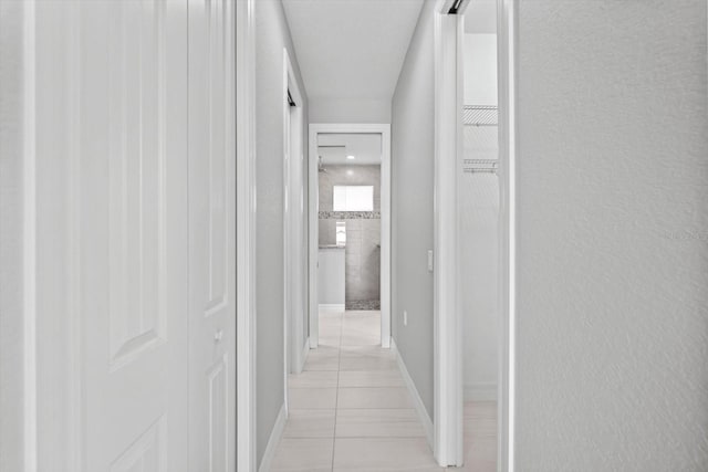 5217 Forbes Ter, Port Charlotte, FL 33981 - hall featuring light tile patterned floors and baseboards