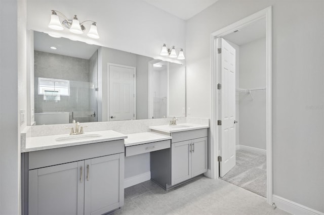 bathroom featuring vanity, tile patterned floors, and a shower with door