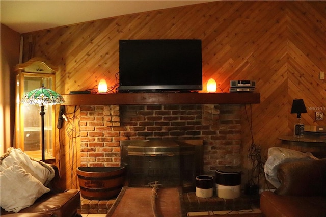 living room with high vaulted ceiling, a brick fireplace, and wood walls