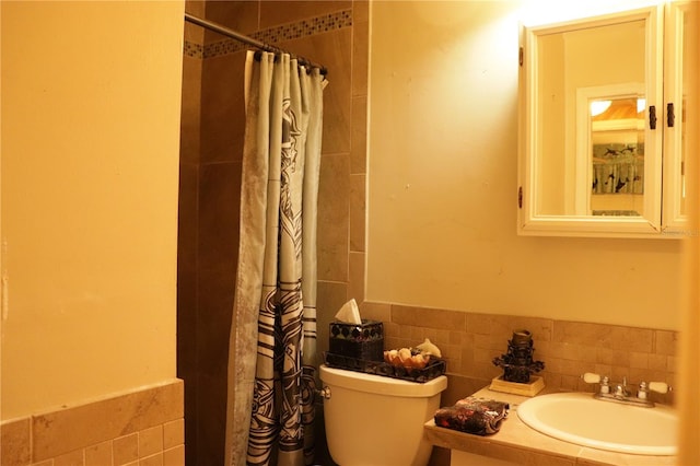 bathroom featuring vanity, toilet, tile walls, and curtained shower