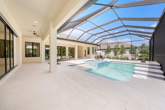 view of swimming pool featuring an in ground hot tub, a lanai, and a patio area