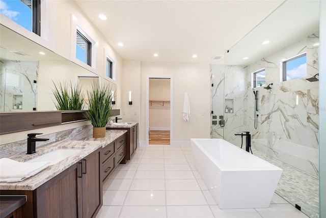 bathroom featuring independent shower and bath and vanity