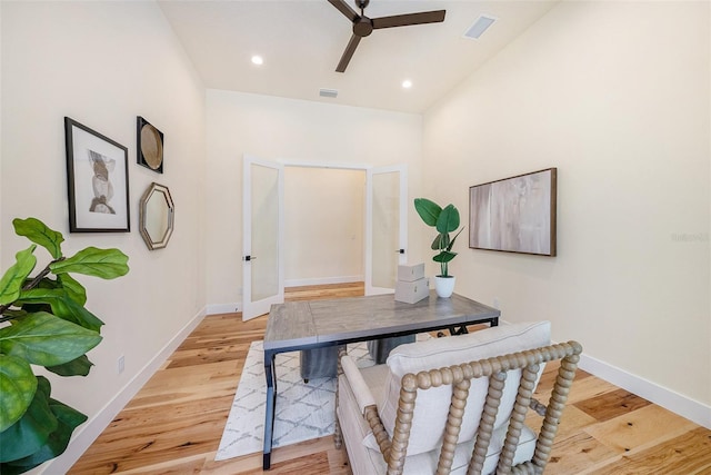 office area with ceiling fan and light hardwood / wood-style floors