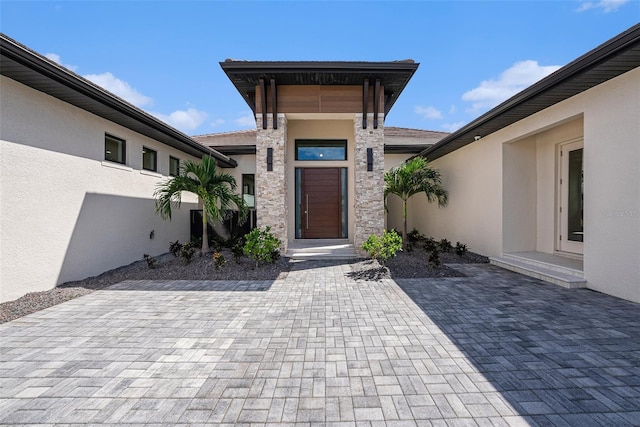 entrance to property featuring a patio