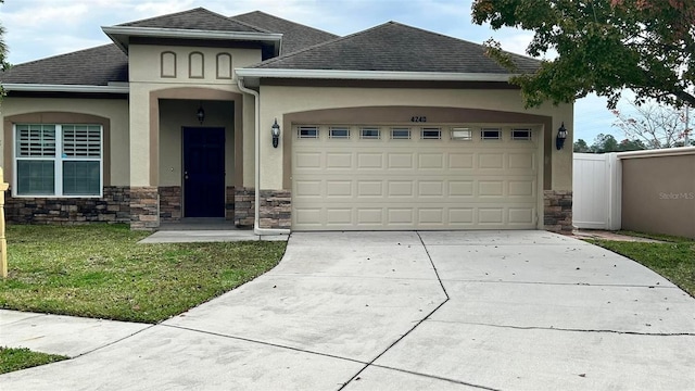 view of front of house featuring a garage and a front yard