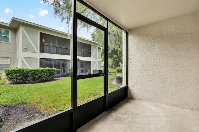 unfurnished sunroom featuring a wealth of natural light