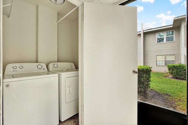 laundry area with washing machine and dryer