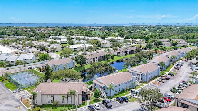 bird's eye view featuring a residential view and a water view