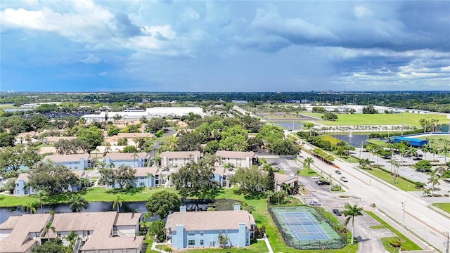 birds eye view of property with a residential view and a water view