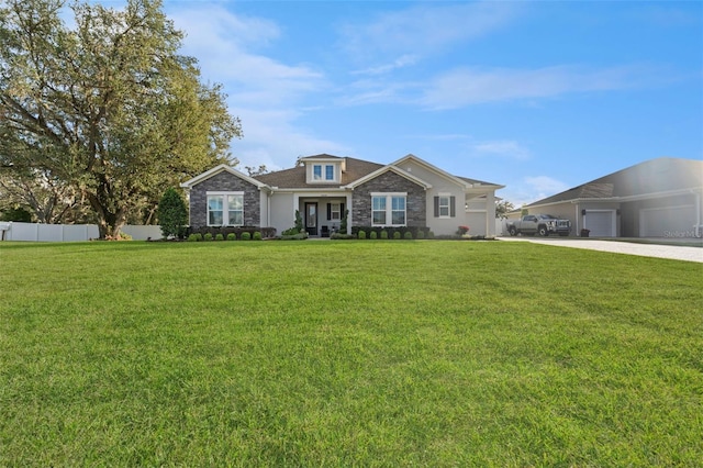 view of front facade with a garage and a front yard