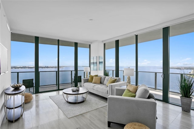 sunroom / solarium with a water view