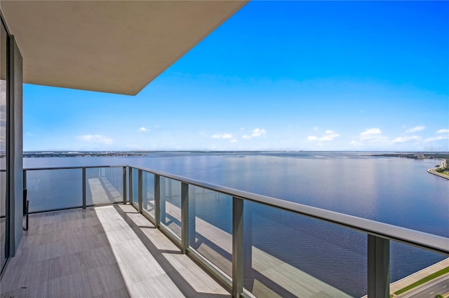 balcony featuring a water view