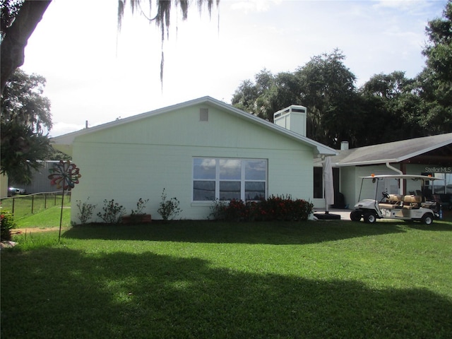 view of property exterior featuring a lawn