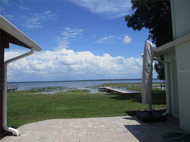 view of patio with a water view