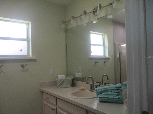 bathroom with vanity and walk in shower