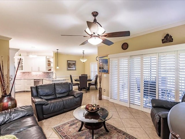 living room with a healthy amount of sunlight, light tile patterned floors, and ceiling fan