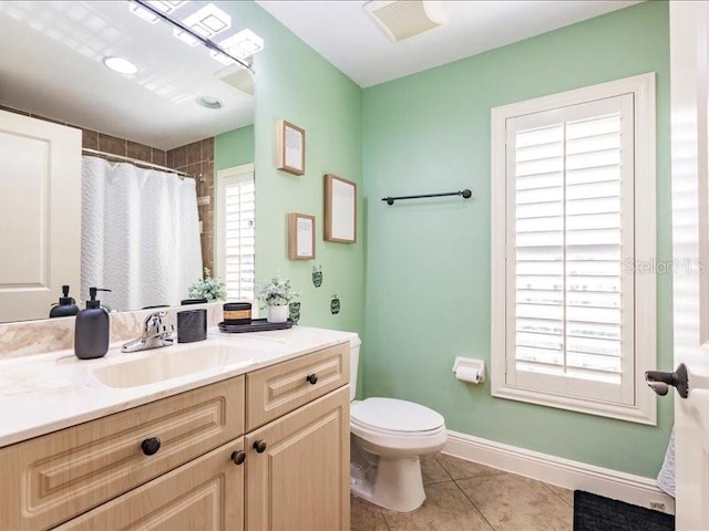 bathroom with tile patterned flooring, vanity, toilet, and a shower with curtain