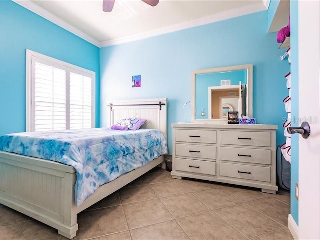 tiled bedroom with ceiling fan and ornamental molding