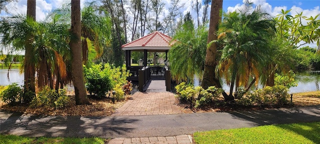 surrounding community featuring a water view and a gazebo