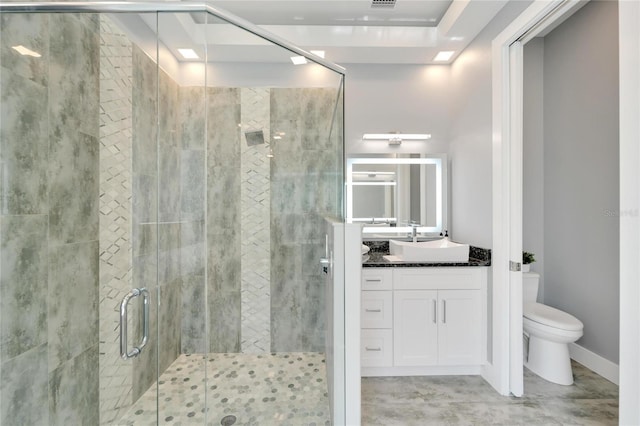 bathroom featuring visible vents, toilet, a stall shower, vanity, and baseboards