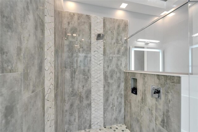 full bathroom with tiled shower