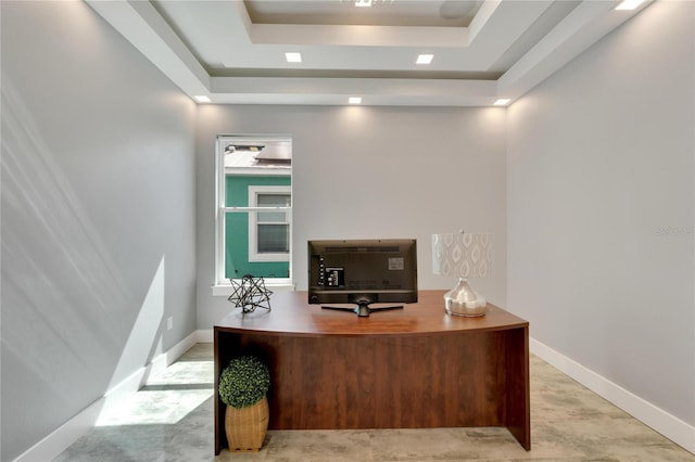 office with baseboards and a tray ceiling