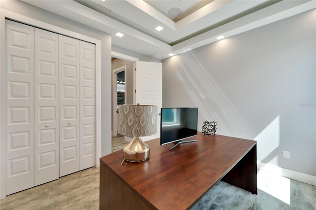 home office with light wood finished floors