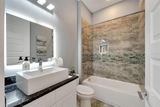 bathroom featuring toilet, shower / tub combination, and vanity