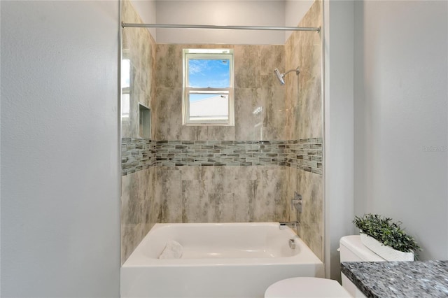 bathroom with shower / bathing tub combination and toilet