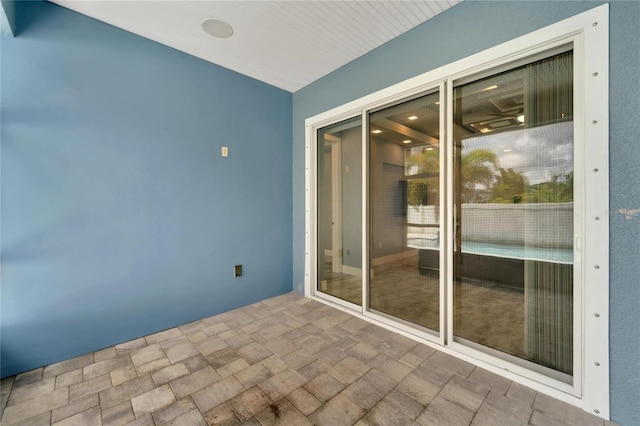 spare room with stone finish floor