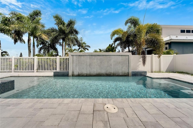 view of pool with a fenced in pool and fence