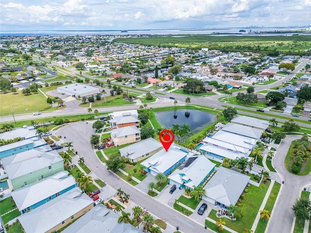 aerial view with a water view and a residential view