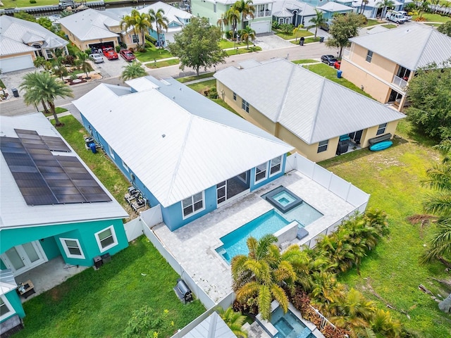 birds eye view of property with a residential view