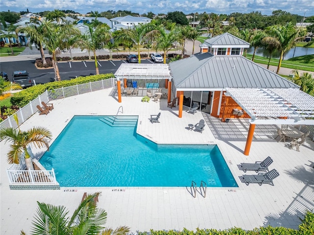 community pool with a gazebo, fence, a pergola, and a patio