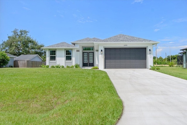 view of front of house featuring a garage and a front yard