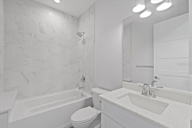 bathroom with washtub / shower combination, toilet, and vanity