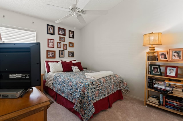 bedroom featuring carpet floors, ceiling fan, a textured ceiling, and baseboards