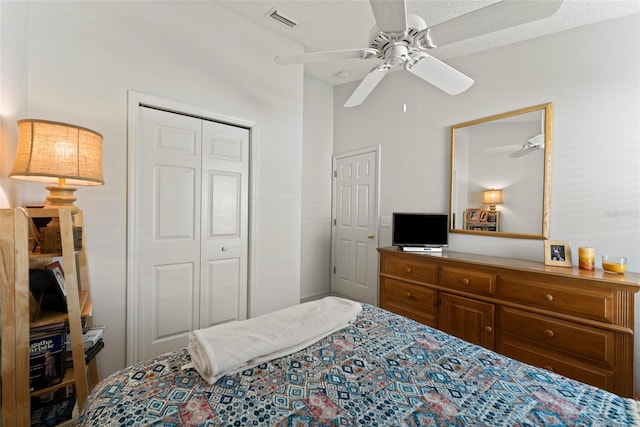 bedroom featuring a closet, visible vents, and a ceiling fan