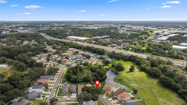 birds eye view of property featuring a residential view and a water view