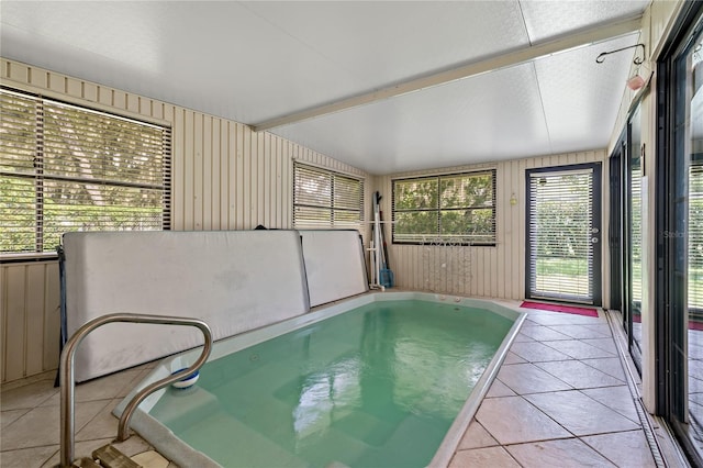 unfurnished sunroom featuring a jacuzzi