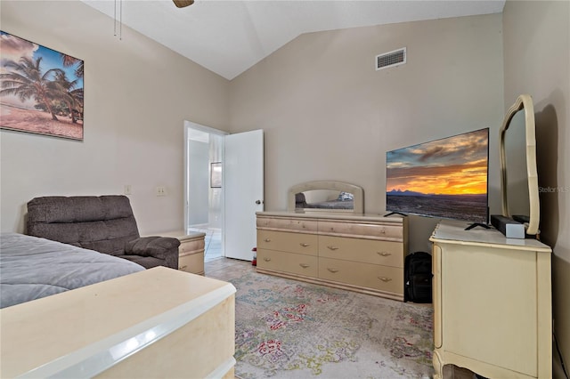 bedroom with ceiling fan and high vaulted ceiling