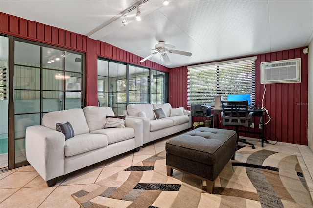 interior space with rail lighting, a wall unit AC, and ceiling fan