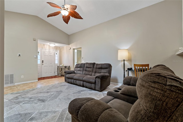 tiled living room with lofted ceiling and ceiling fan