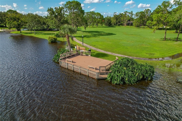 exterior space with a water view and a yard