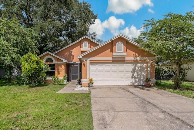 view of front of house featuring a garage and a front yard