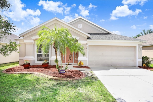 view of front of home featuring a front yard and a garage