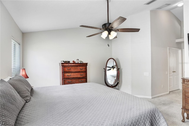 carpeted bedroom featuring vaulted ceiling and ceiling fan