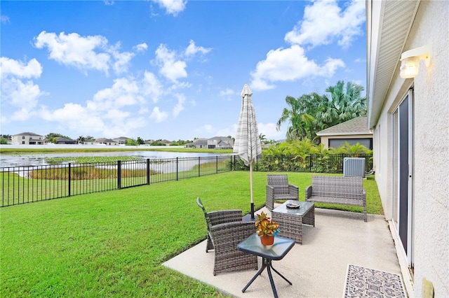 view of yard featuring a patio and a water view